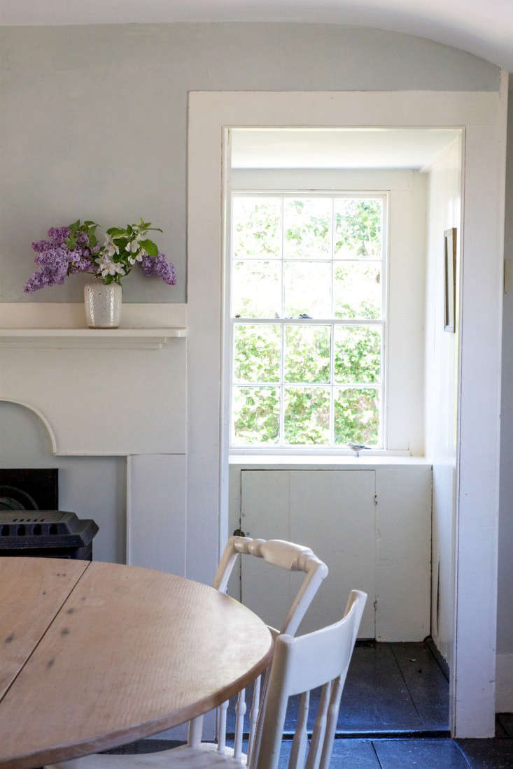 In my own Cape Cod cottage, note how with the absence of curtains, the eye is drawn right through several rooms and out the window beyond. Photograph by Justine Hand for Remodelista.